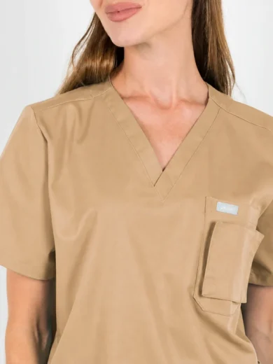 Beige short-sleeve scrub top with a V-neck and a rectangular chest pocket on the left side.