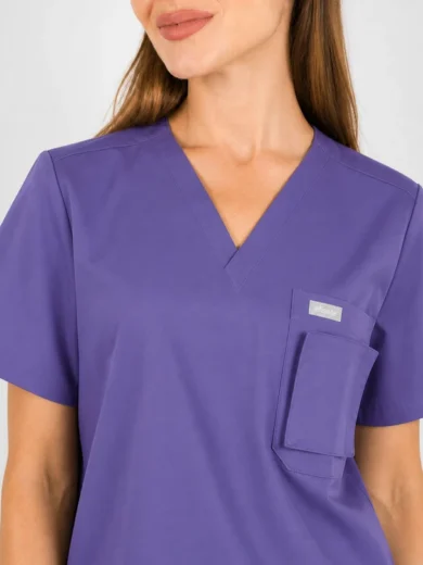 Purple scrub top with a V-neck and short sleeves, featuring a chest pocket with a small label.