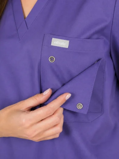 Purple medical scrubs with a chest pocket and folded front pocket being opened, showing a small label that reads 'efisafe'.