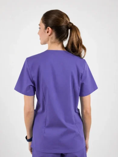 Back view of a person in purple medical scrubs with a ponytail hairstyle.