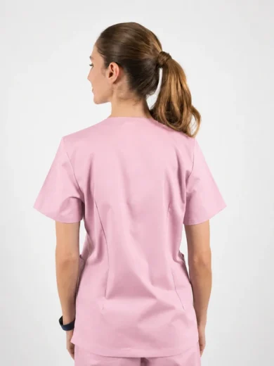 Back view of a person wearing light pink scrubs with a ponytail on the neck/behind the head? Actually ponytail.