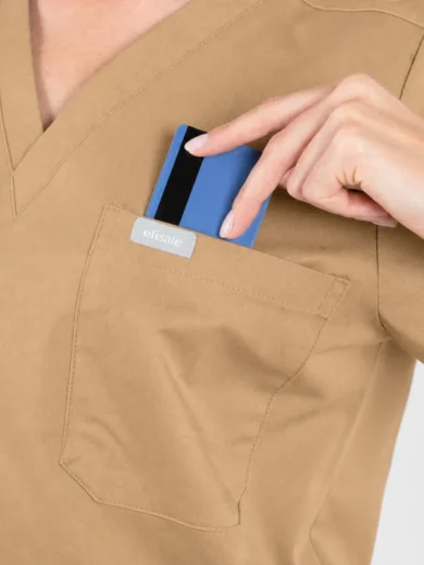 Person in tan scrubs places a blue card into the chest pocket on the uniform's left side.