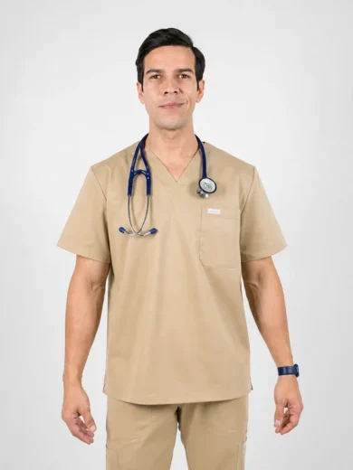 Male healthcare professional in beige scrubs with a stethoscope around his neck, facing forward.