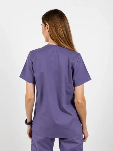 Back view of a person in purple medical scrubs (short-sleeve top and pants) against a neutral background