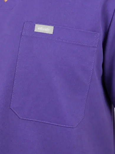 Close-up of a purple scrub top pocket with a small 'efisafe' brand tag, showing stitching and fabric texture.