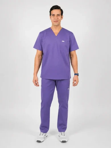 Man in purple medical scrubs (V-neck top, pants) standing straight against a light gray background.