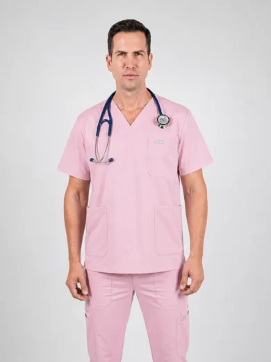 Healthcare professional wearing pink scrubs with stethoscope around neck, facing the camera.