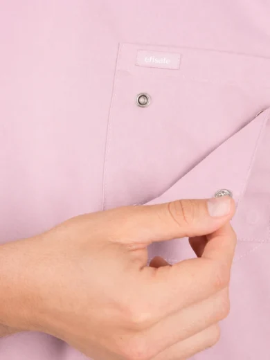 Close-up of a pink shirt pocket being fastened with a metal snap button