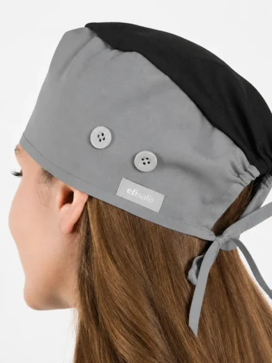 Gray surgical cap with black top, tied at the back, featuring two buttons and a brand label on the side (efisafe)
