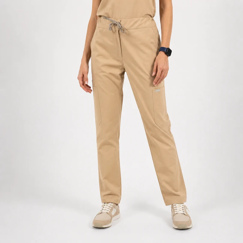 Beige cargo pants with a drawstring waist and side pockets, shown with beige sneakers on a model