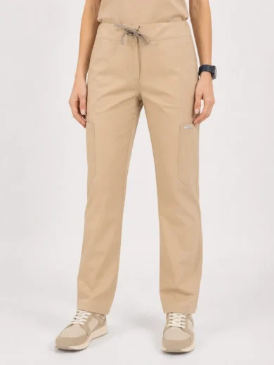 Beige cargo pants with a drawstring waist and front patch pockets, paired with matching sneakers.