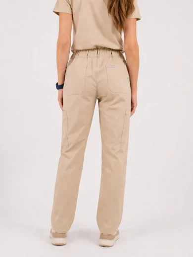 Back view of a person wearing beige cargo-style jogger pants with an elastic waistband and large back pockets.