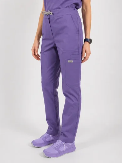 Purple scrub pants with drawstring waist and cargo pocket, worn with matching sneakers and a smartwatch on the wrist (informative product image).