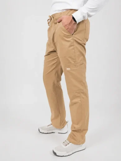 Person wearing tan cargo pants with drawstring waist and multiple pockets, paired with white sneakers and a white top.