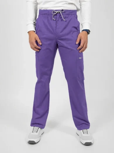 Man wearing purple cargo pants with a drawstring waist, front pockets, and white sneakers on a plain backdrop.